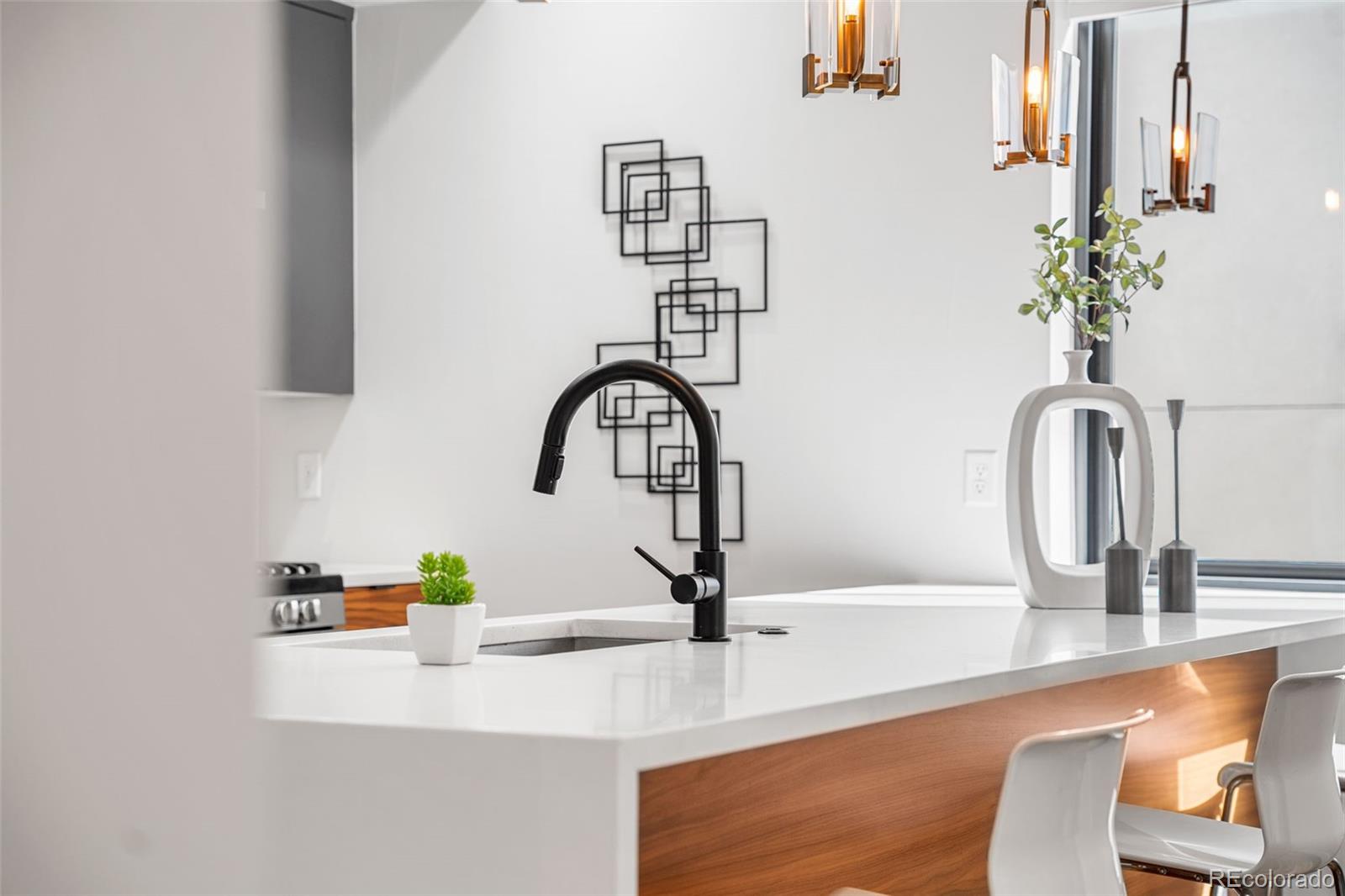 3644 Quivas Street, Unit 2 Denver, CO 80211 - Photo 19 of 49 a bathroom with a sink and a mirror