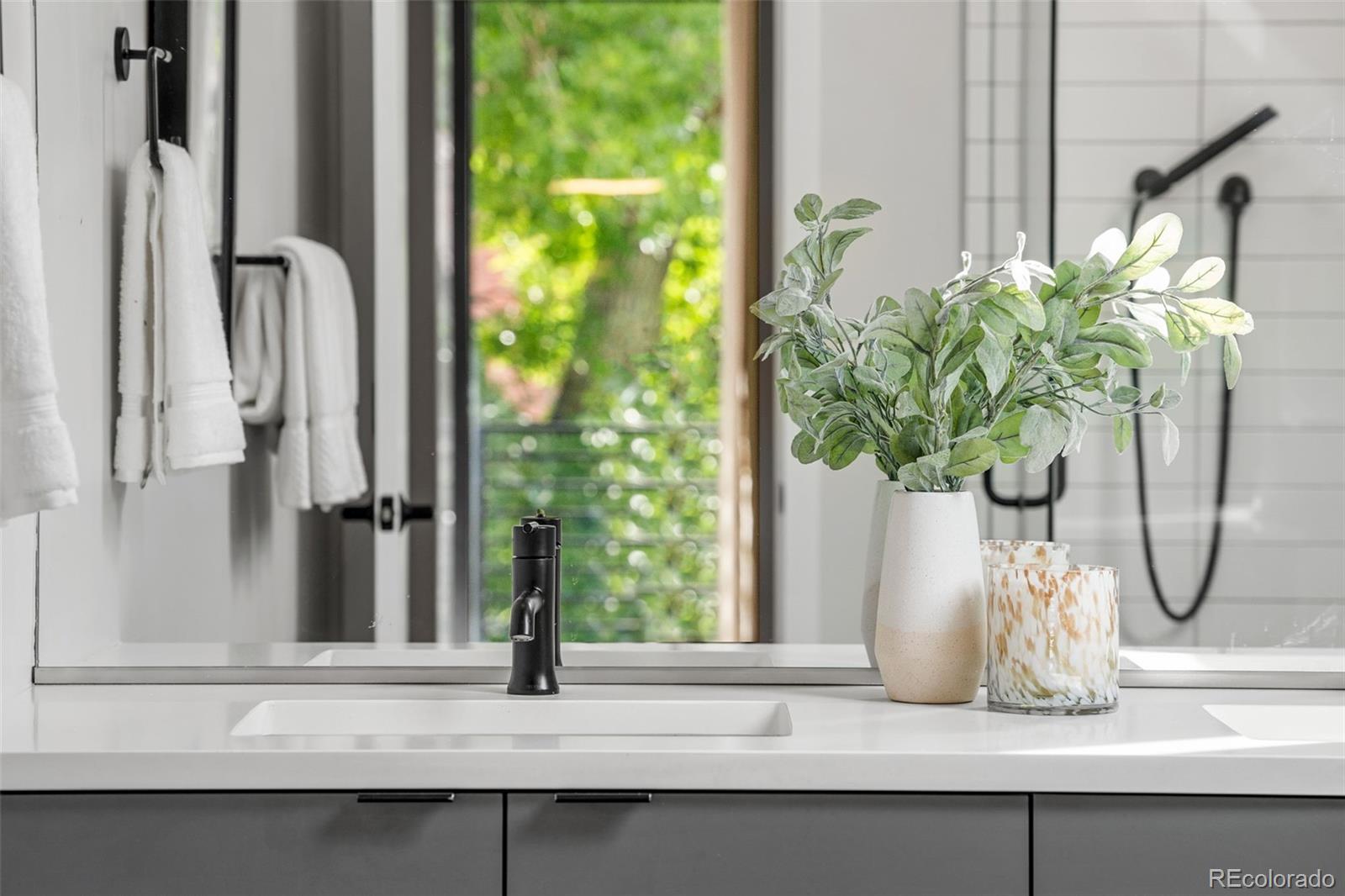 3644 Quivas Street, Unit 2 Denver, CO 80211 - Photo 24 of 49 a white vase with flowers and a window
