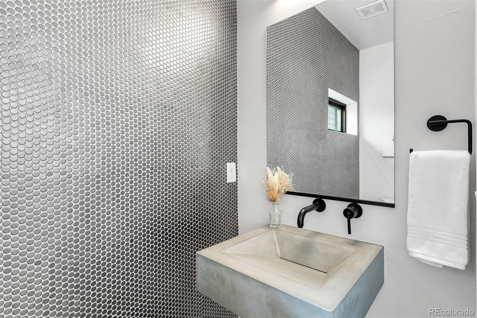 3644 Quivas Street, Unit 2 Denver, CO 80211 - Photo 25 of 49 a bathroom with a sink and a mirror