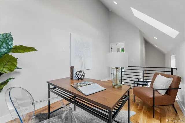 a bedroom with a bed and a lamp