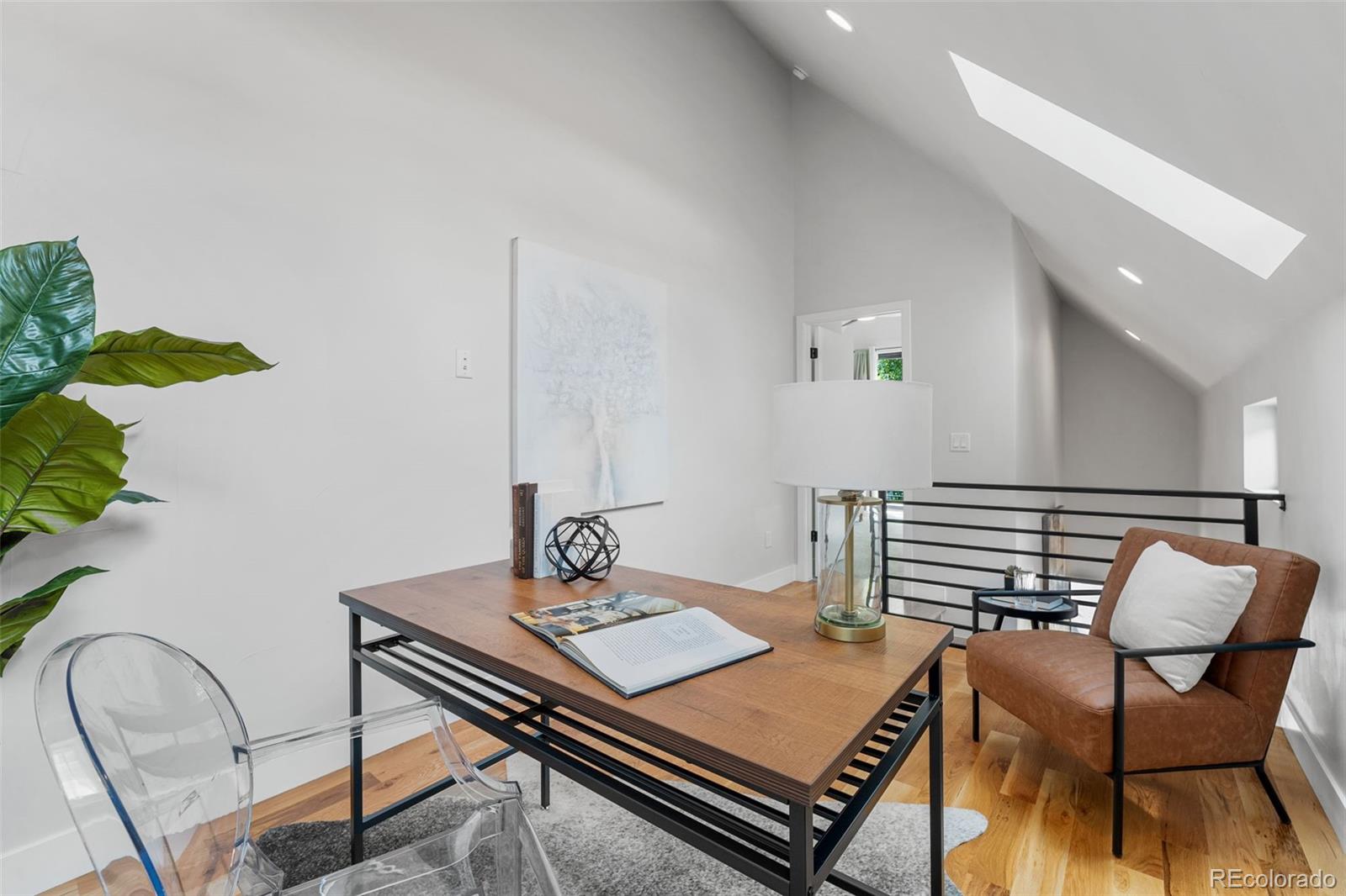 3644 Quivas Street, Unit 2 Denver, CO 80211 - Photo 29 of 49 a living room with furniture and wooden floor