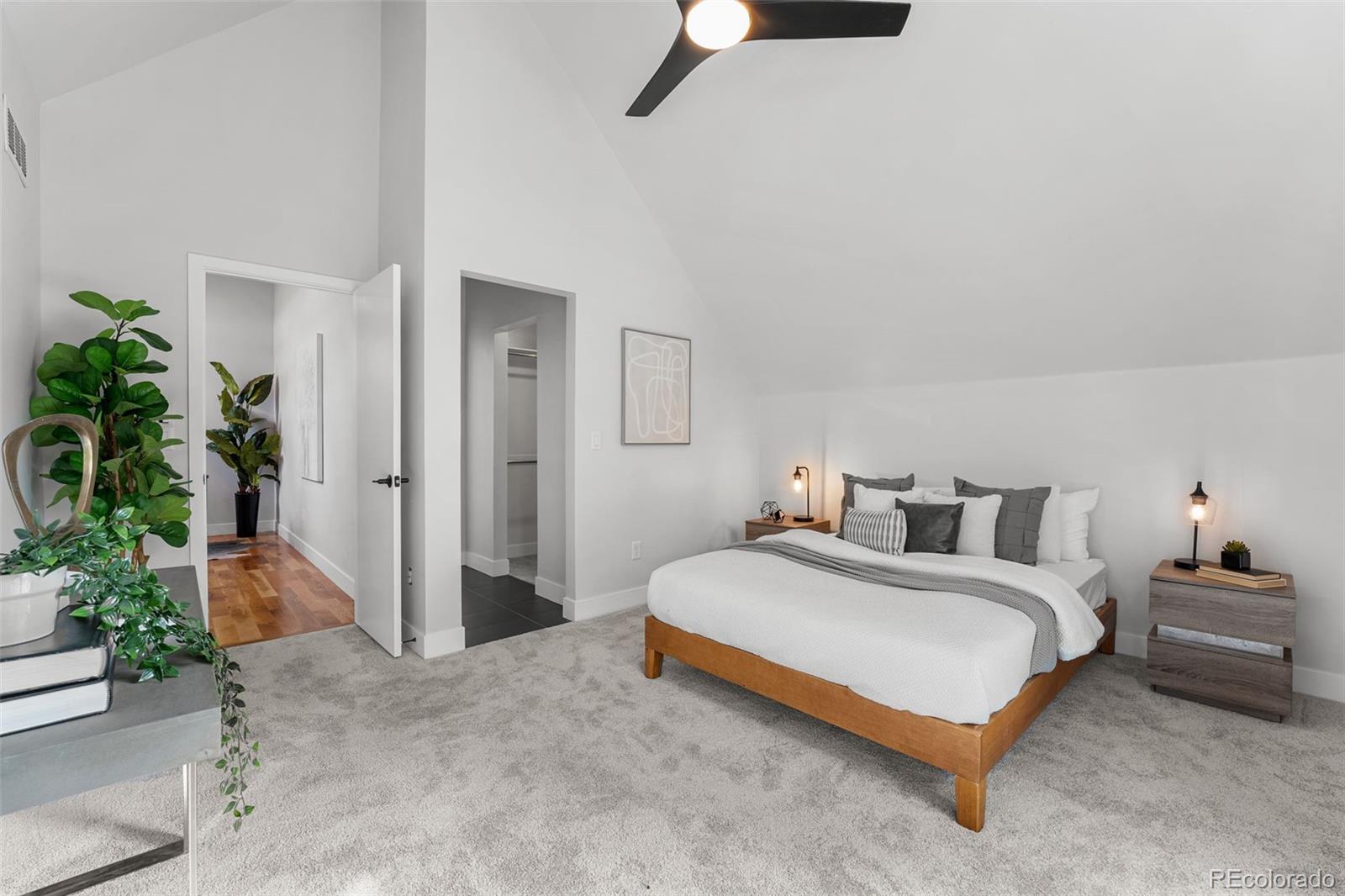 3644 Quivas Street, Unit 2 Denver, CO 80211 - Photo 32 of 49 a bedroom with a bed and potted plant