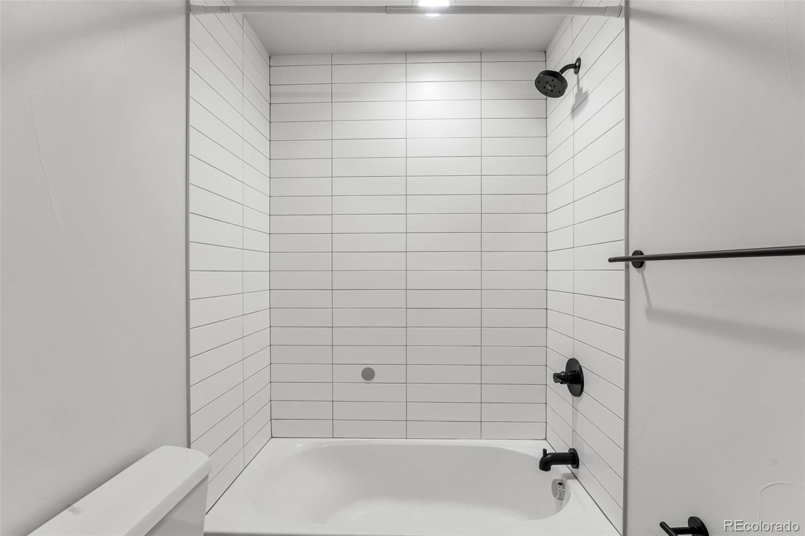 3644 Quivas Street, Unit 2 Denver, CO 80211 - Photo 42 of 49 a bathroom with a bathtub