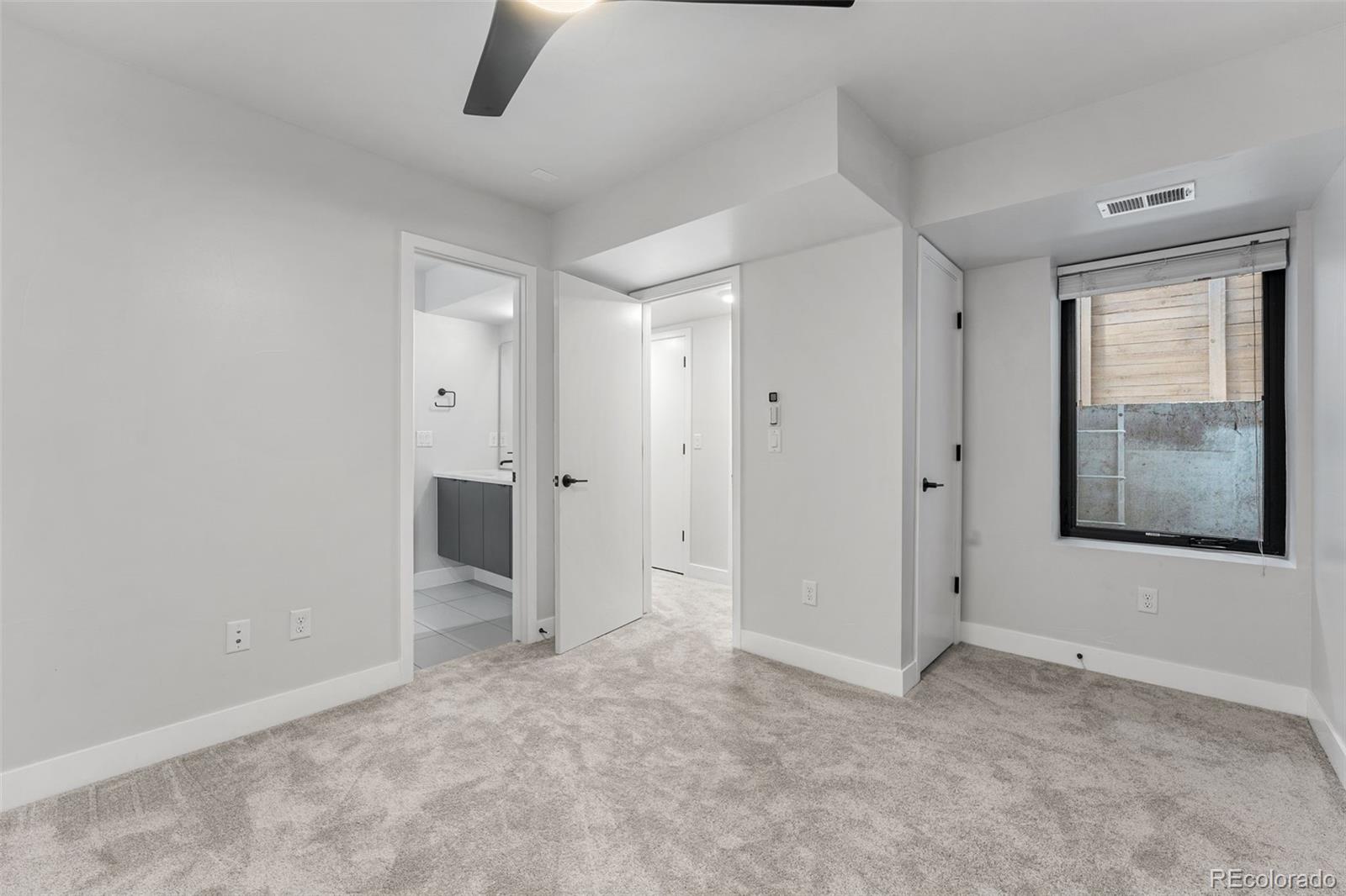 3644 Quivas Street, Unit 2 Denver, CO 80211 - Photo 43 of 49 an empty room with closet and windows