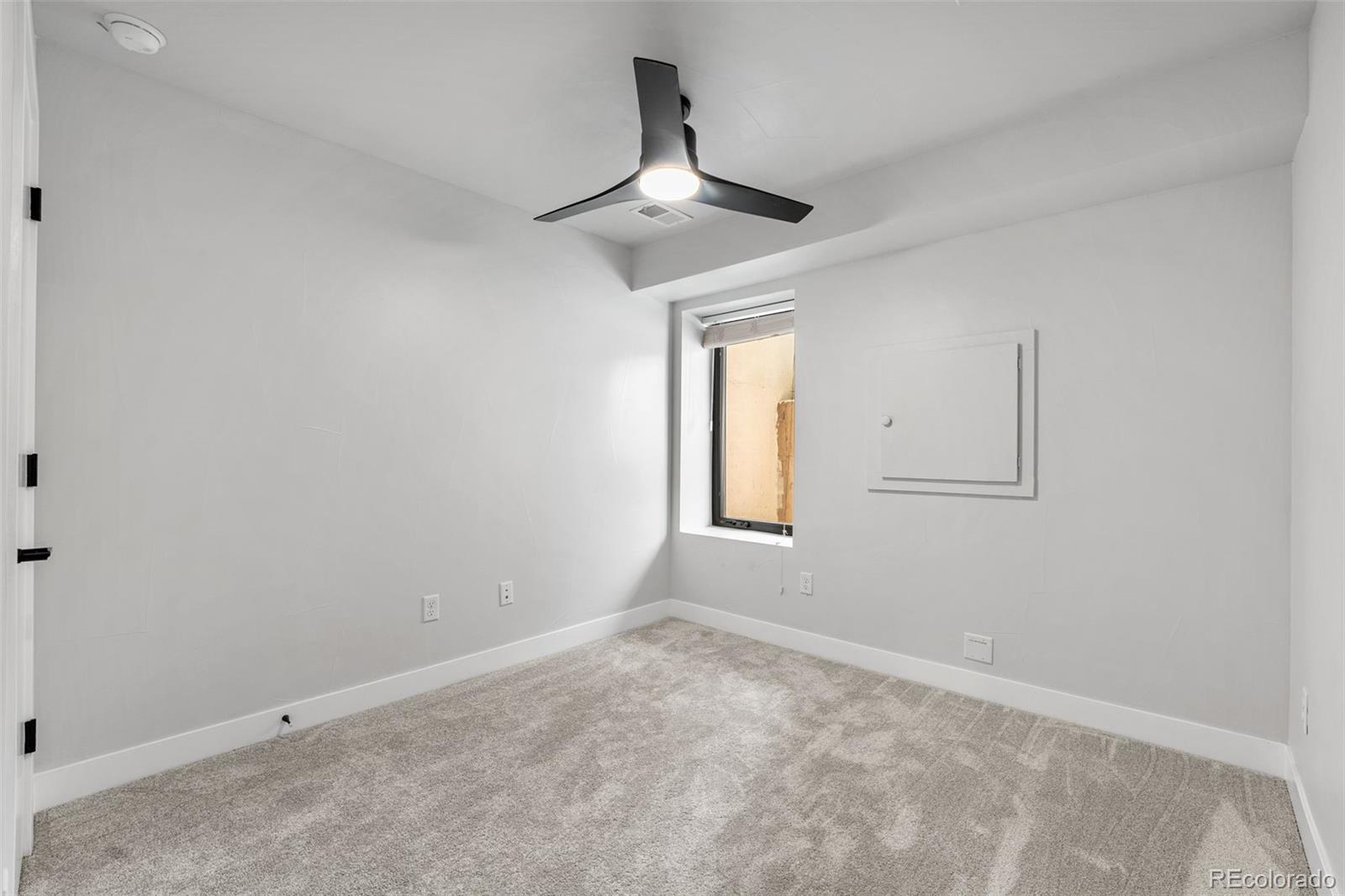 3644 Quivas Street, Unit 2 Denver, CO 80211 - Photo 44 of 49 an empty room with windows and fan