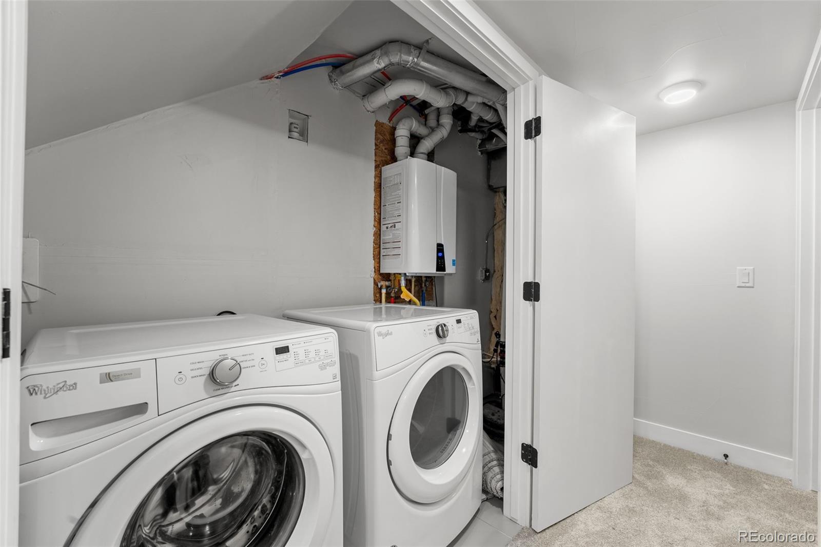 3644 Quivas Street, Unit 2 Denver, CO 80211 - Photo 46 of 49 a view of storage and utility room with washer and dryer
