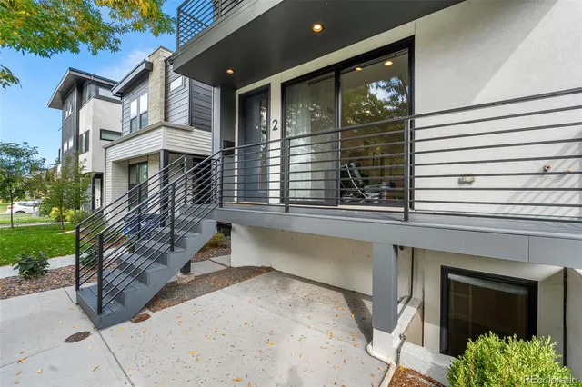 a view of a balcony with couches and wooden floor