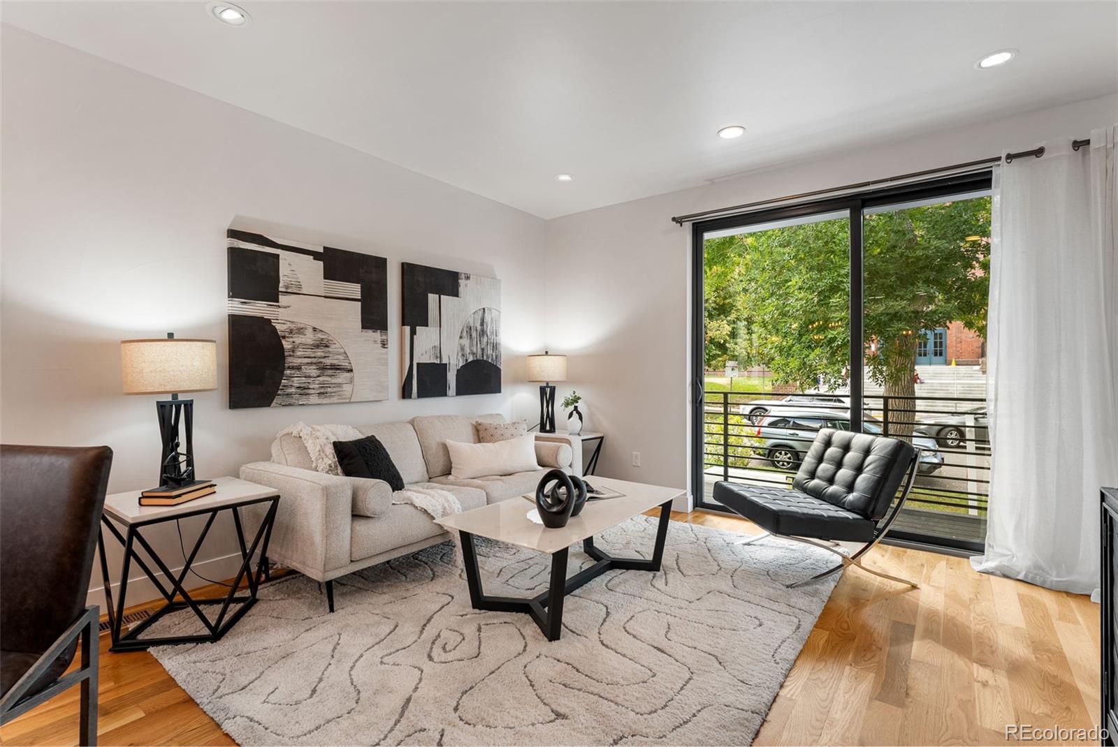 3644 Quivas Street, Unit 2 Denver, CO 80211 - Photo 7 of 49 a living room with furniture and a floor to ceiling window