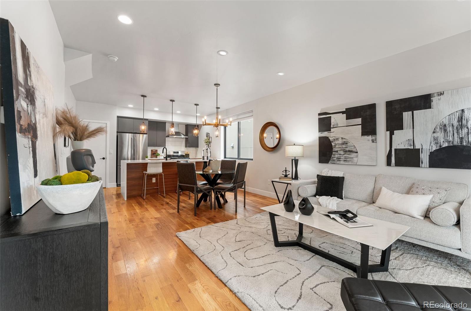 3644 Quivas Street, Unit 2 Denver, CO 80211 - Photo 10 of 49 a living room with furniture and a table