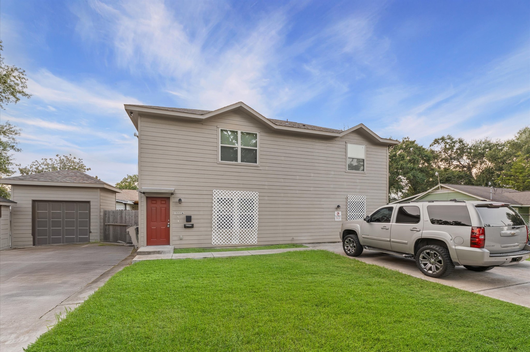 a view of a house with a car park front of a house