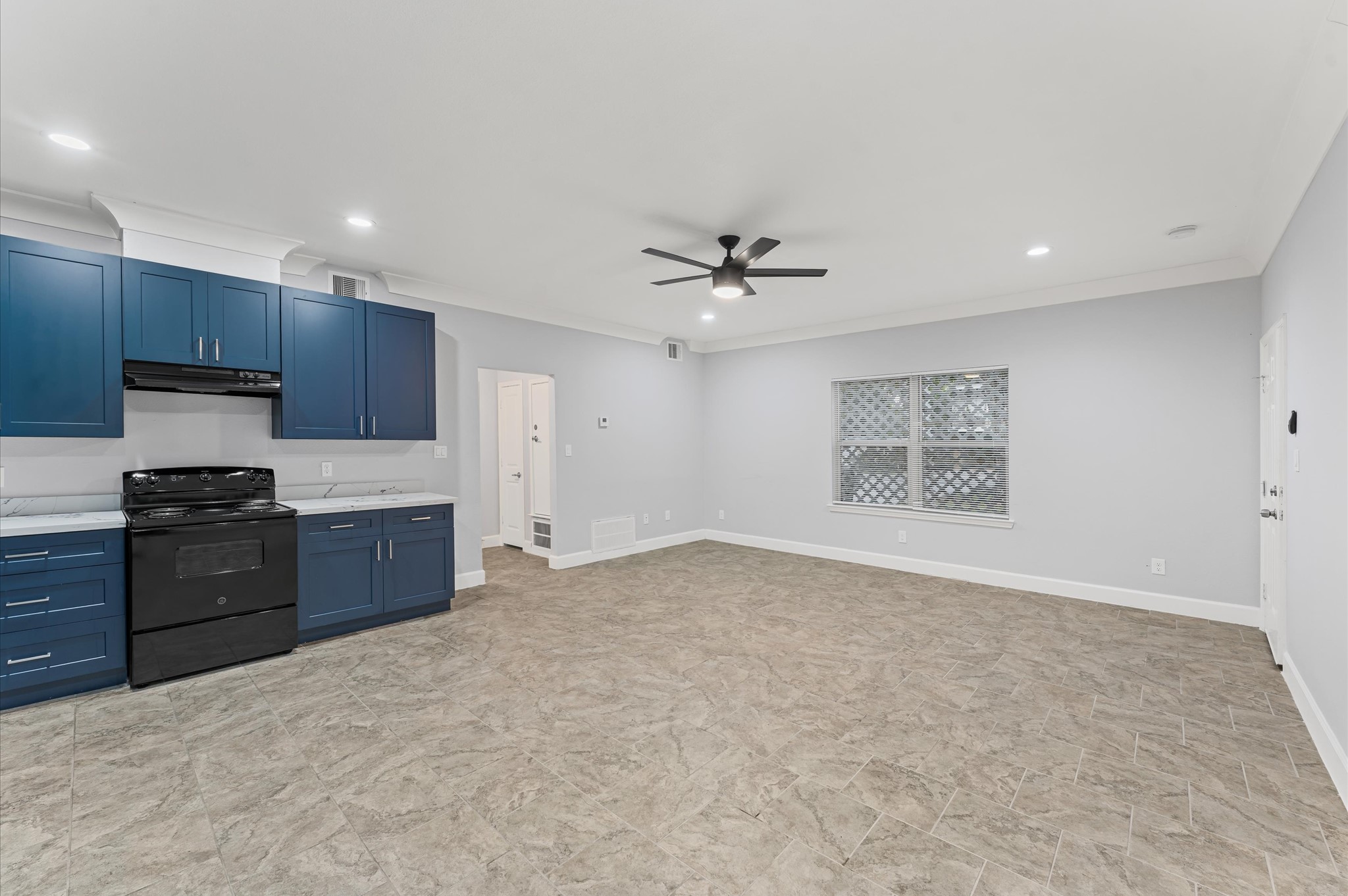 8221 Brockton Street Houston, TX 77017 - Photo 3 of 12 a large kitchen with stainless steel appliances granite countertop a stove a sink and a refrigerator with wooden floor