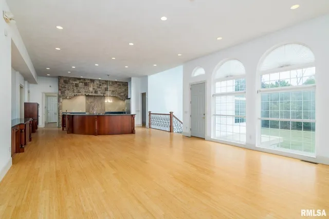 a view of empty room with windows