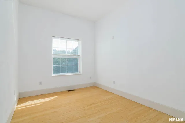 a front view of a house with yard