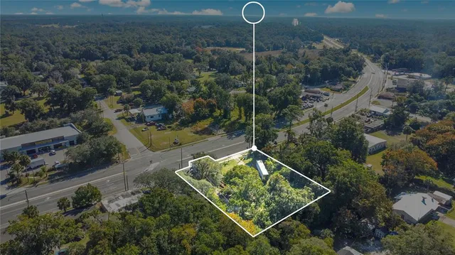 an aerial view of house with yard