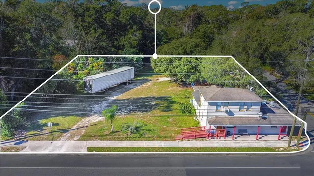 a terrace with outdoor seating and trees