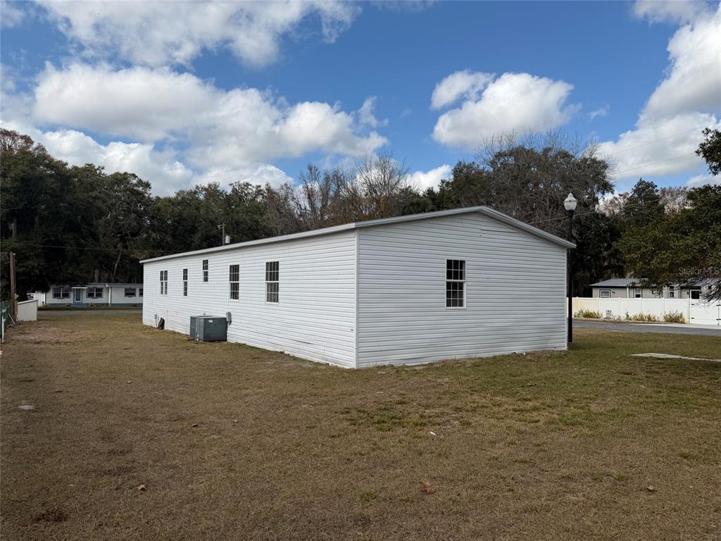 28834 Hubbard Street Leesburg, FL 34748 - Photo 5 of 22 a view of a house with a yard
