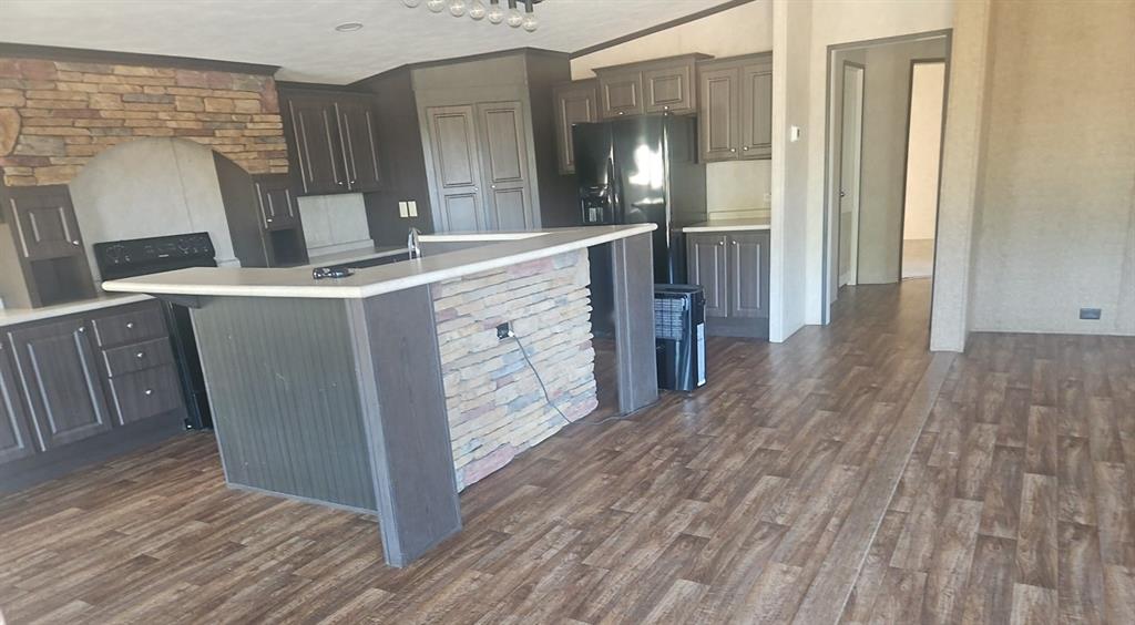 221 Farmhouse Road Springtown, TX 76082 - Photo 13 of 23 a view hallway with wooden floor and staircase