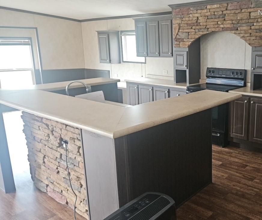 221 Farmhouse Road Springtown, TX 76082 - Photo 14 of 23 a kitchen with stainless steel appliances a sink stove and cabinets