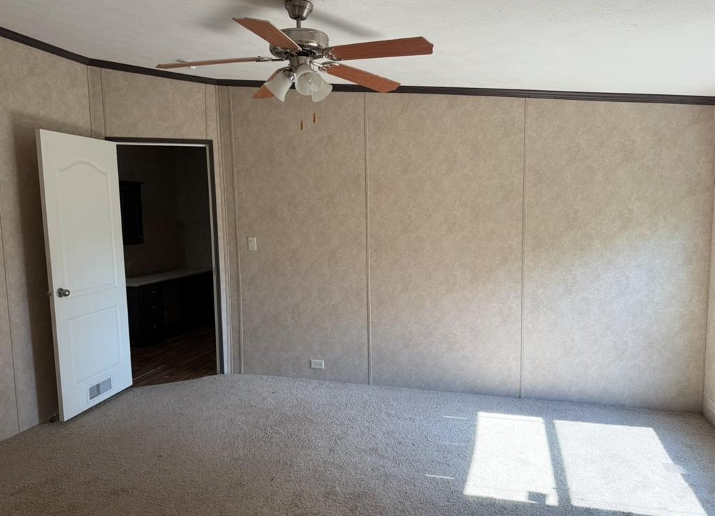 221 Farmhouse Road Springtown, TX 76082 - Photo 18 of 23 an empty room with a window and a ceiling fan