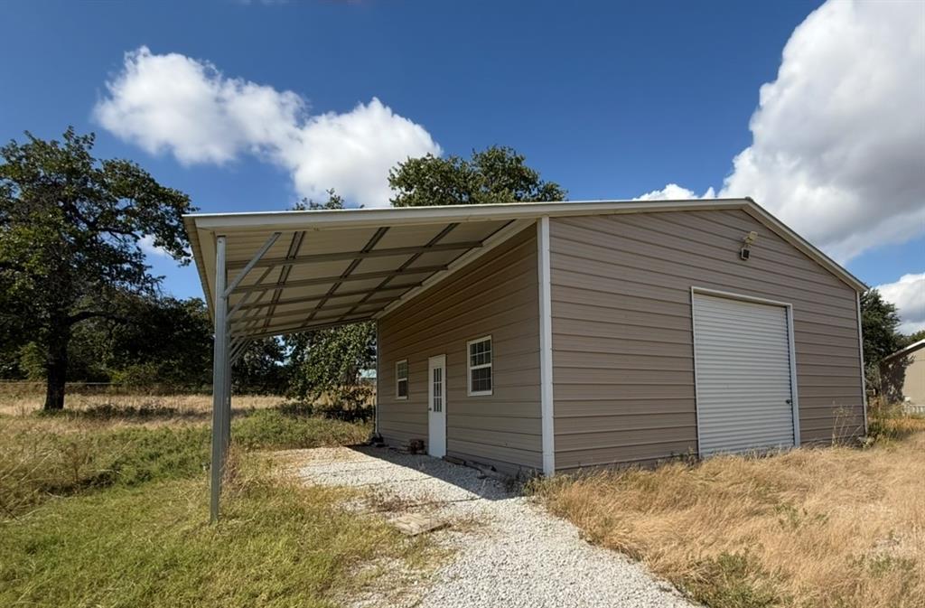 221 Farmhouse Road Springtown, TX 76082 - Photo 2 of 23 a view of a barn