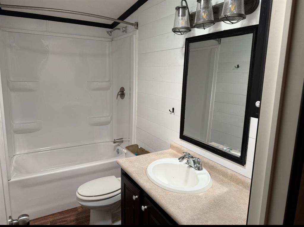 221 Farmhouse Road Springtown, TX 76082 - Photo 23 of 23 a bathroom with a sink and a mirror