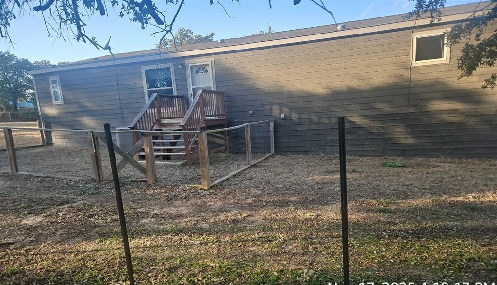 221 Farmhouse Road Springtown, TX 76082 - Photo 5 of 23 a view of a porch with a bench