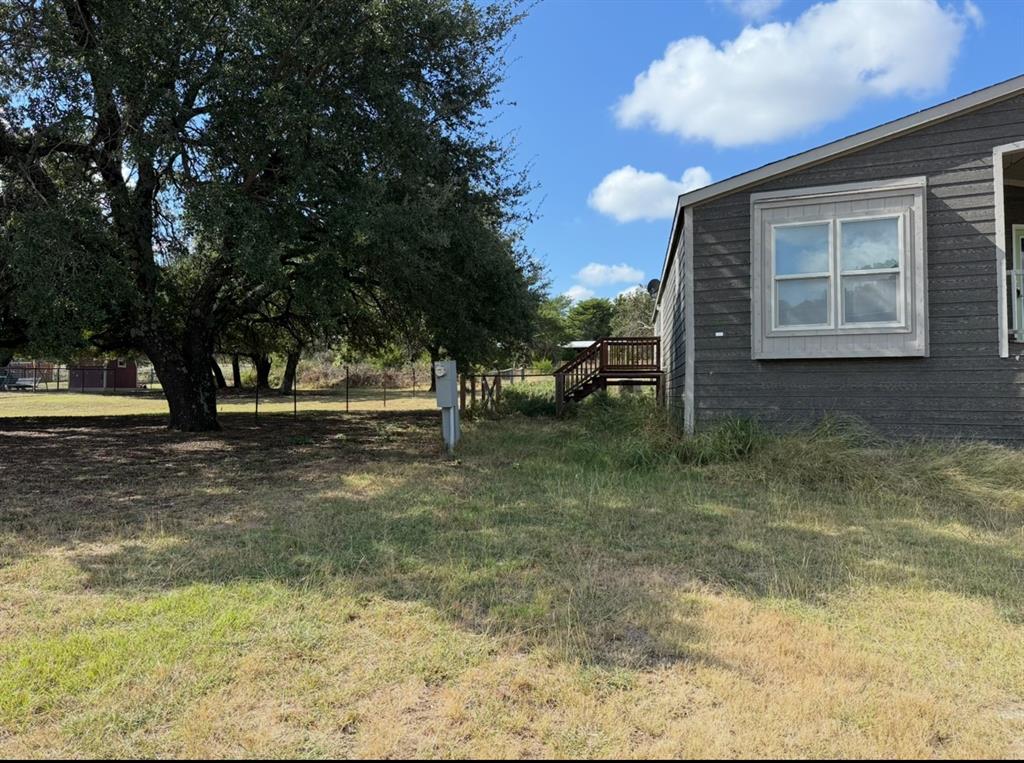 221 Farmhouse Road Springtown, TX 76082 - Photo 6 of 23 a view of outdoor space with garden