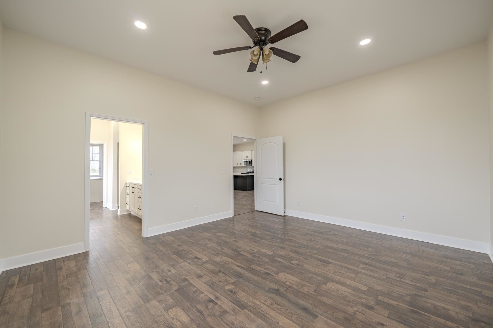 1030 Robbins Road Collinwood, TN 38450 - Photo 16 of 40 Unfurnished room with ceiling fan, dark wood finished floors, and recessed lighting