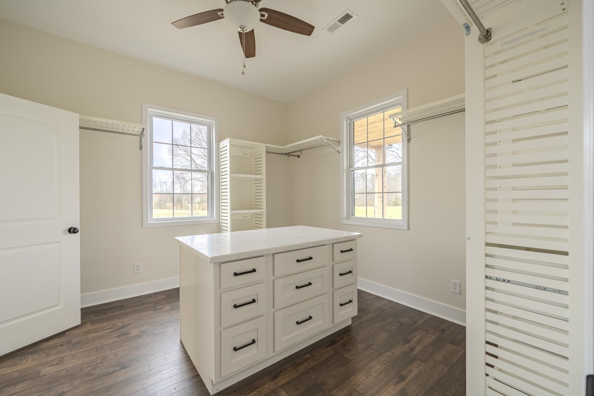 1030 Robbins Road Collinwood, TN 38450 - Photo 20 of 40 Walk in closet with dark wood-style flooring and a ceiling fan