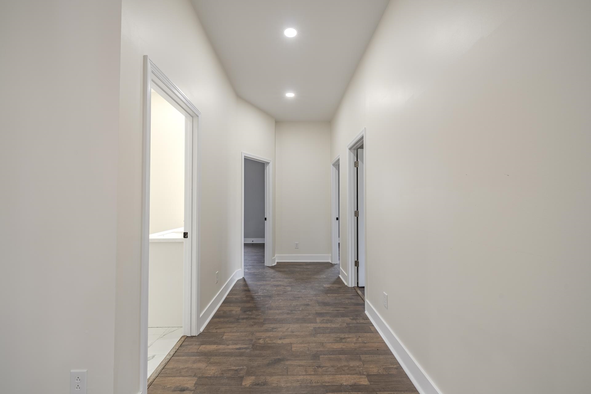 1030 Robbins Road Collinwood, TN 38450 - Photo 24 of 40 Hallway with dark wood finished floors and recessed lighting