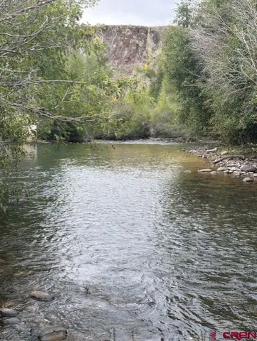 a view of a lake view with houses in back