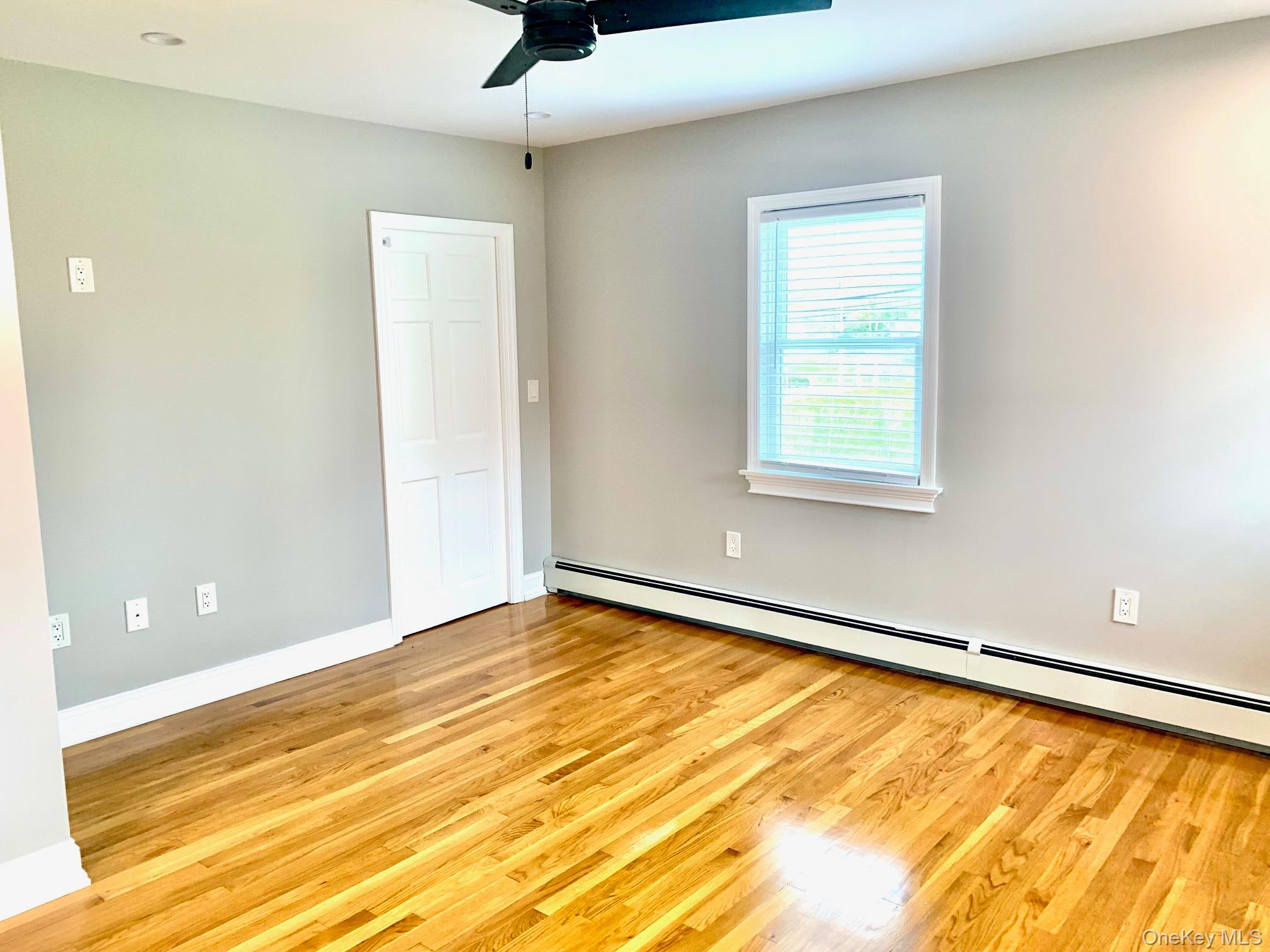 435 Middle Road Riverhead, NY 11901 - Photo 12 of 19 a view of an empty room with a window