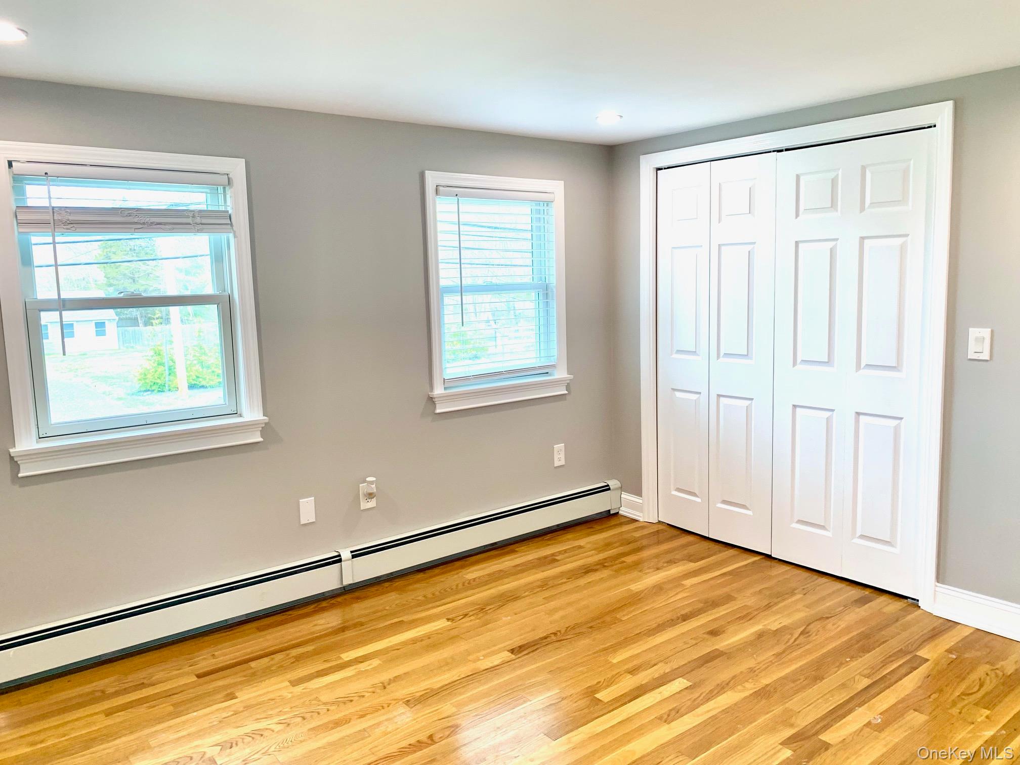 435 Middle Road Riverhead, NY 11901 - Photo 15 of 19 a view of an empty room with a window