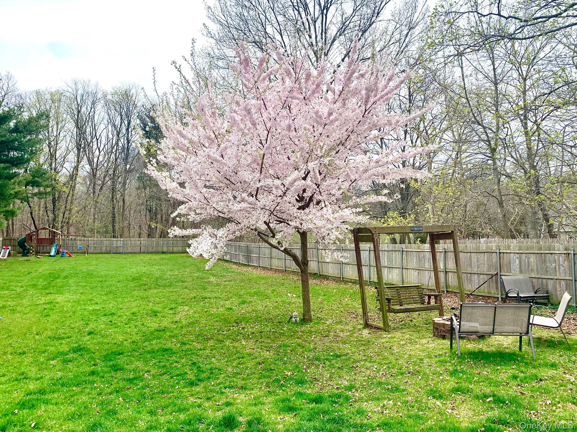 435 Middle Road Riverhead, NY 11901 - Photo 18 of 19 a view of a bench in the garden