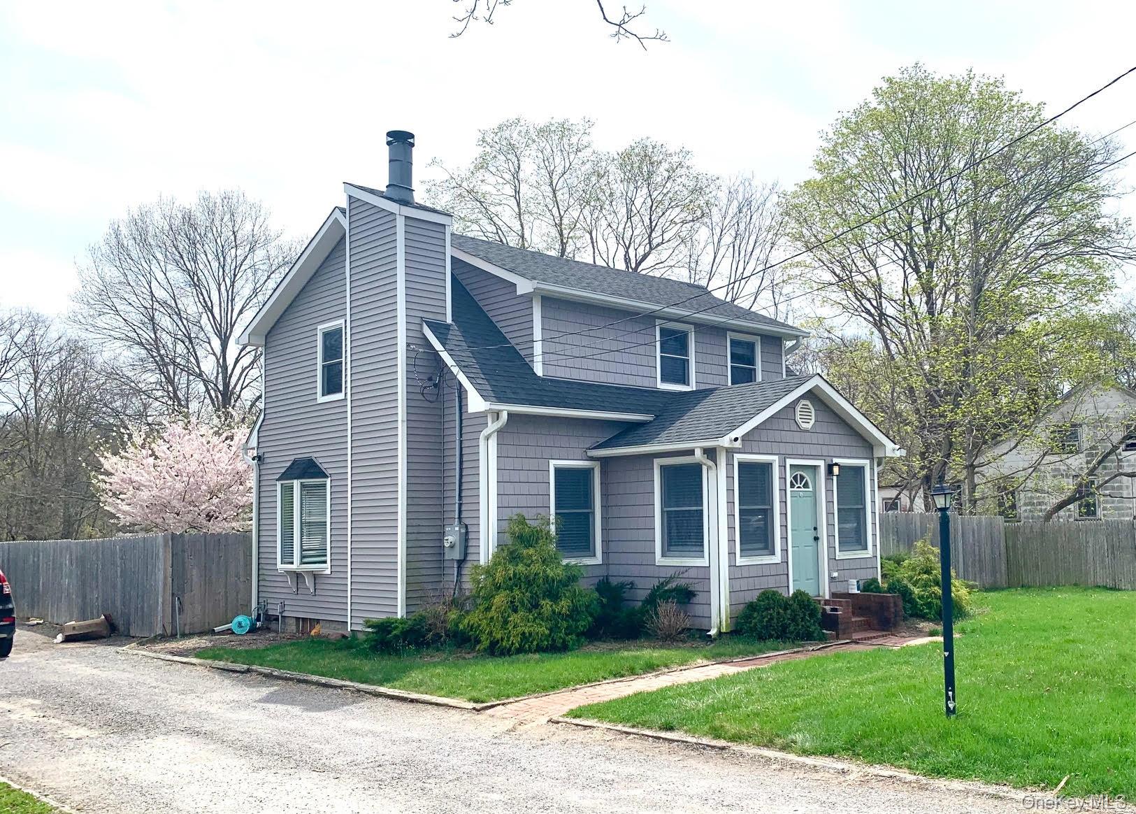 435 Middle Road Riverhead, NY 11901 - Photo 19 of 19 a front view of a house with a yard