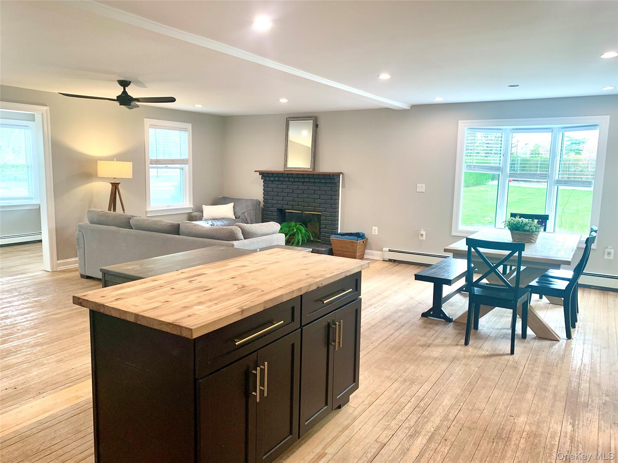 435 Middle Road Riverhead, NY 11901 - Photo 5 of 19 a kitchen with a table and chairs in it
