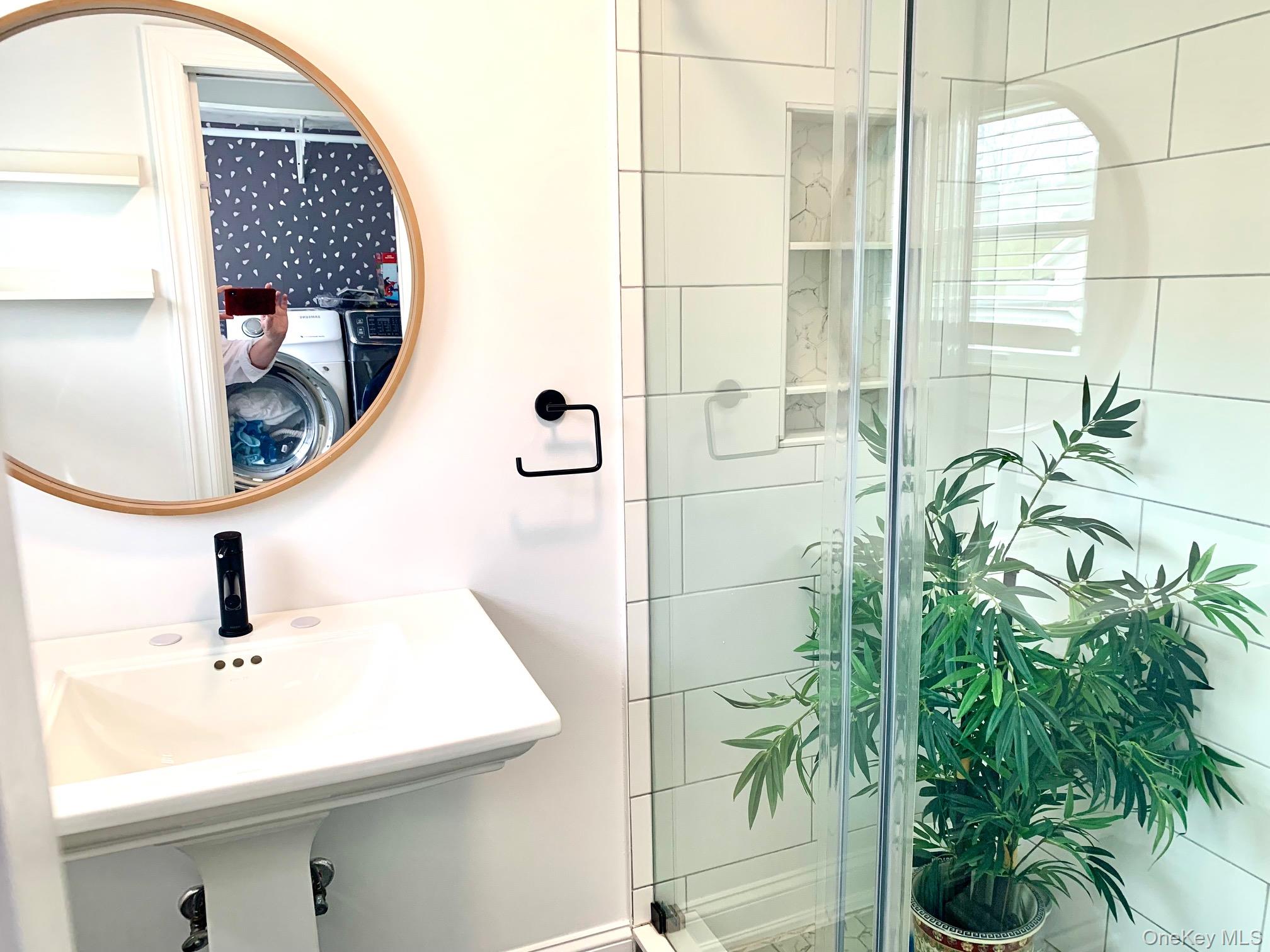 435 Middle Road Riverhead, NY 11901 - Photo 8 of 19 a bathroom with a sink and mirror