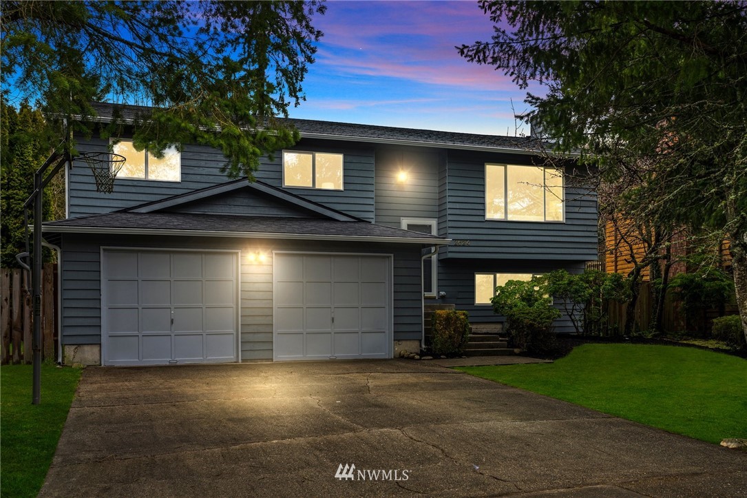2624 166th Street Southeast Bothell, WA 98012 - Photo 1 of 29 a front view of a house with a yard and garage