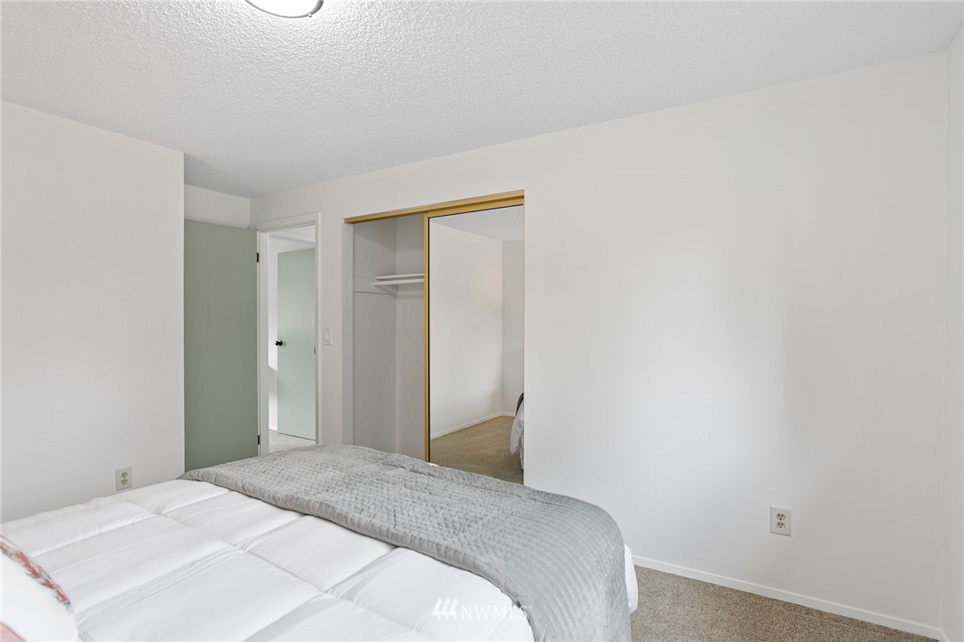 2624 166th Street Southeast Bothell, WA 98012 - Photo 16 of 29 a bedroom with a bed and a mirror