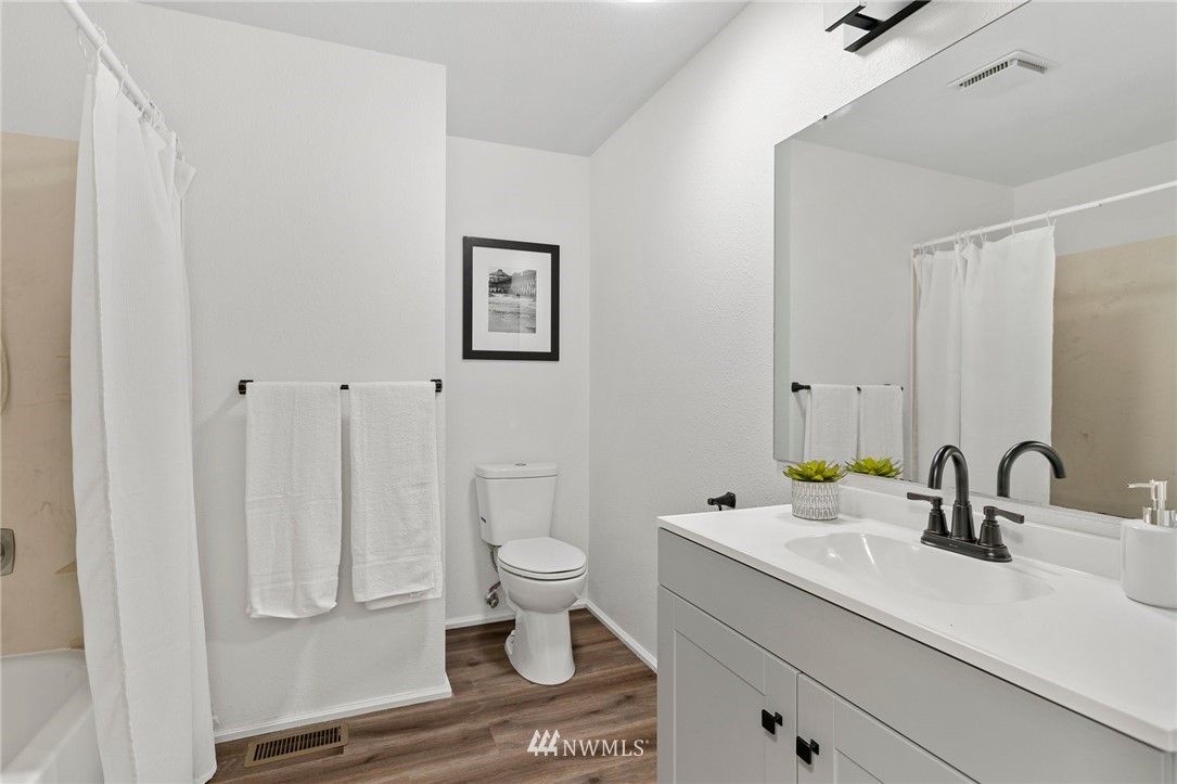 2624 166th Street Southeast Bothell, WA 98012 - Photo 18 of 29 a bathroom with a sink toilet and shower