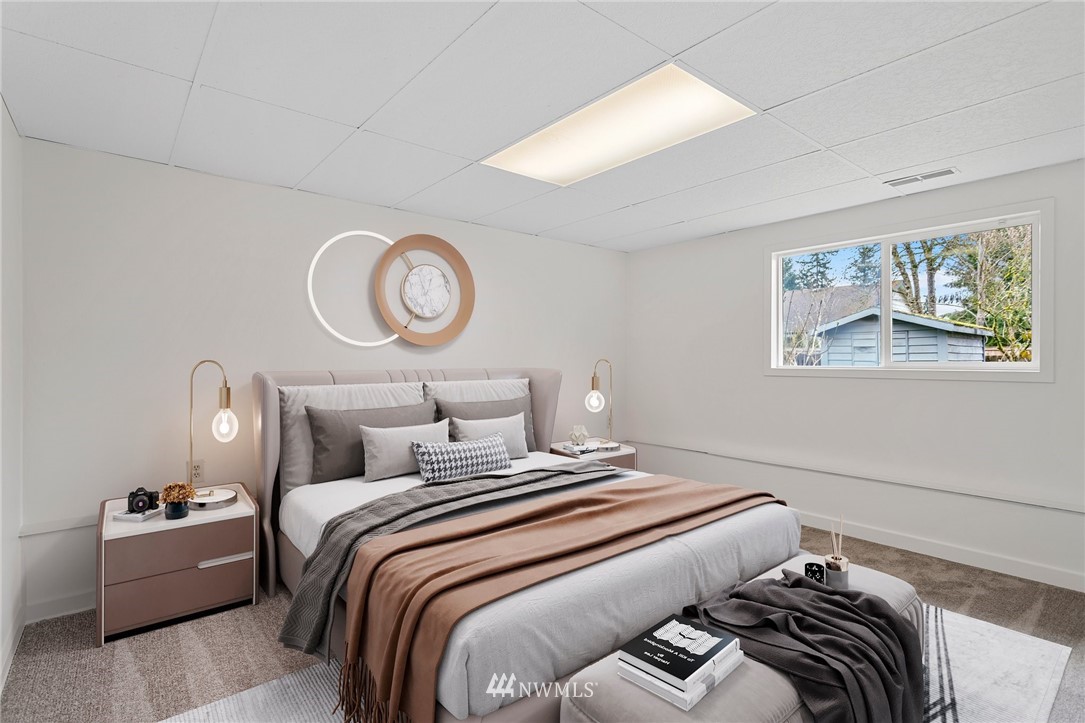 2624 166th Street Southeast Bothell, WA 98012 - Photo 21 of 29 a bedroom with a bed and a lamp