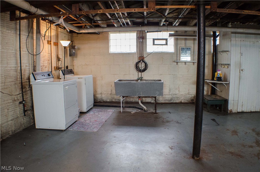 1123 Berwin Street Akron, OH 44310 - Photo 26 of 34 The laundry area of the basement, washer and dryer are included. to the right of the post is the 1/2 bath (the man's bath).