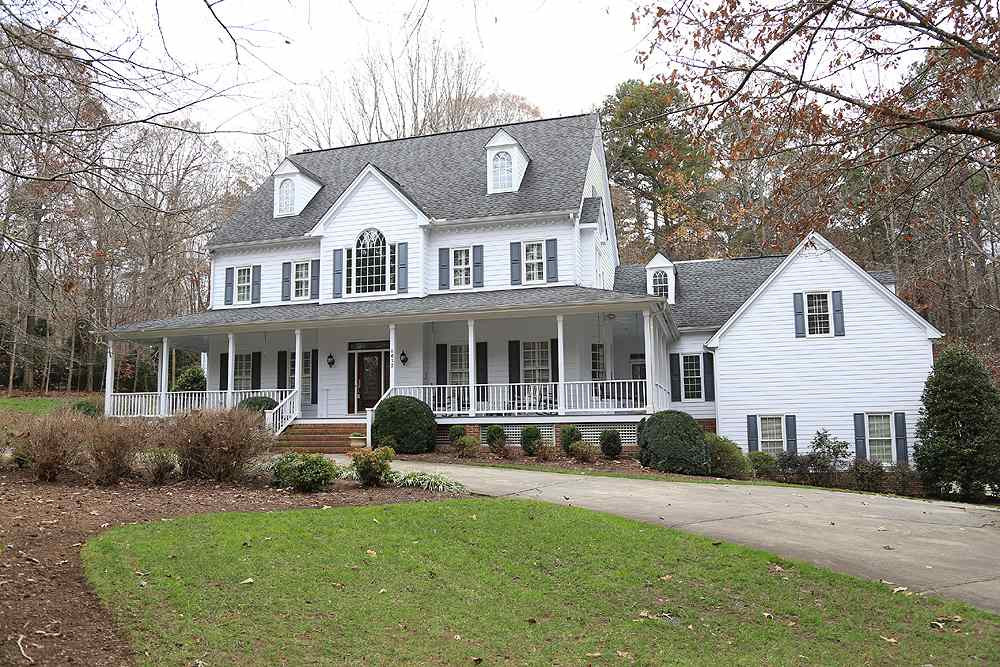 8617 Cold Springs Road Raleigh, NC 27615 - Photo 1 of 30 Wonderful setting with circular drive, wrap around porch, 3 car garage! Exterior Front