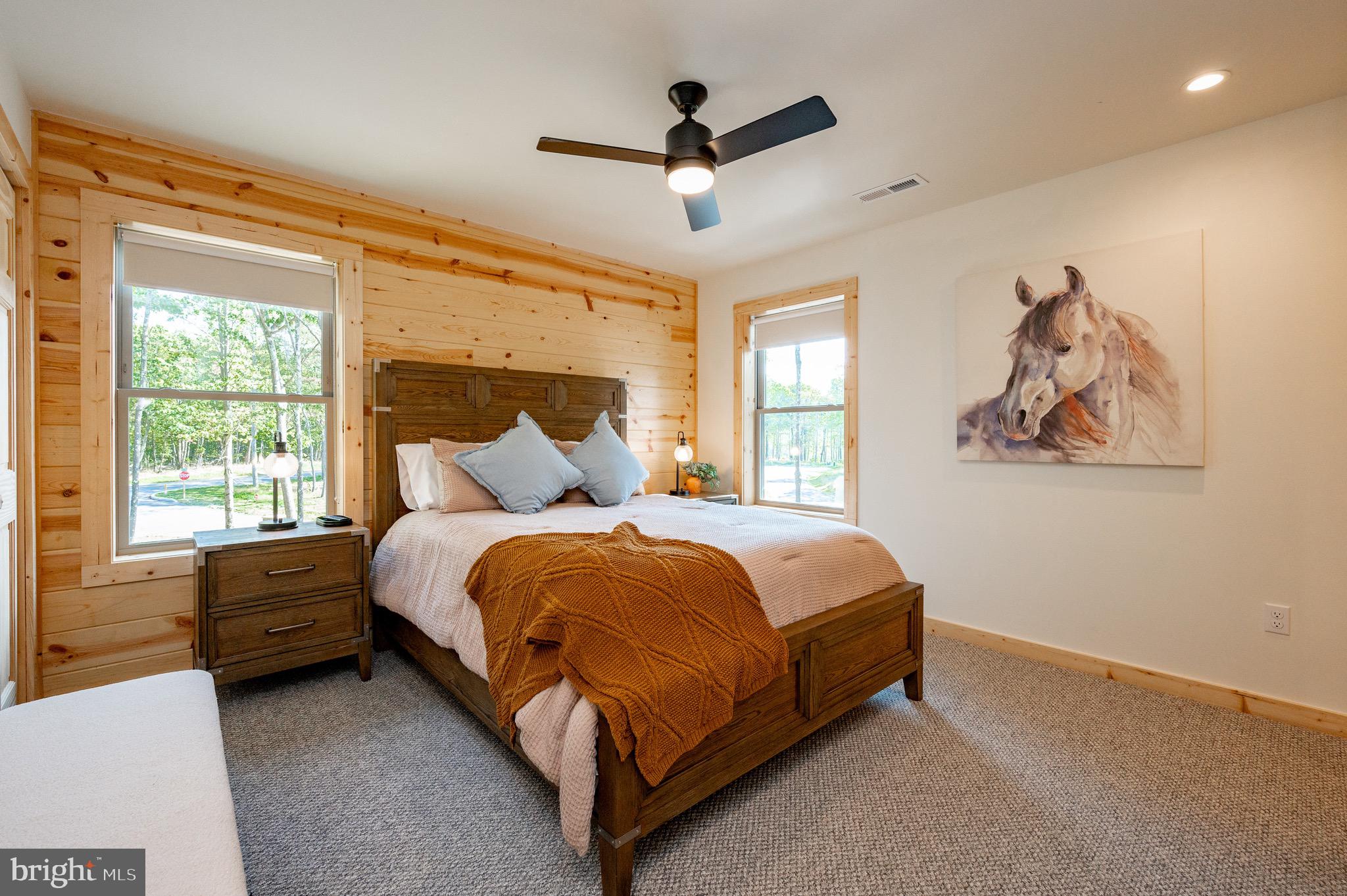 36 Irwin Way Oakland, MD 21550 - Photo 28 of 64 a spacious bedroom with a bed and a window
