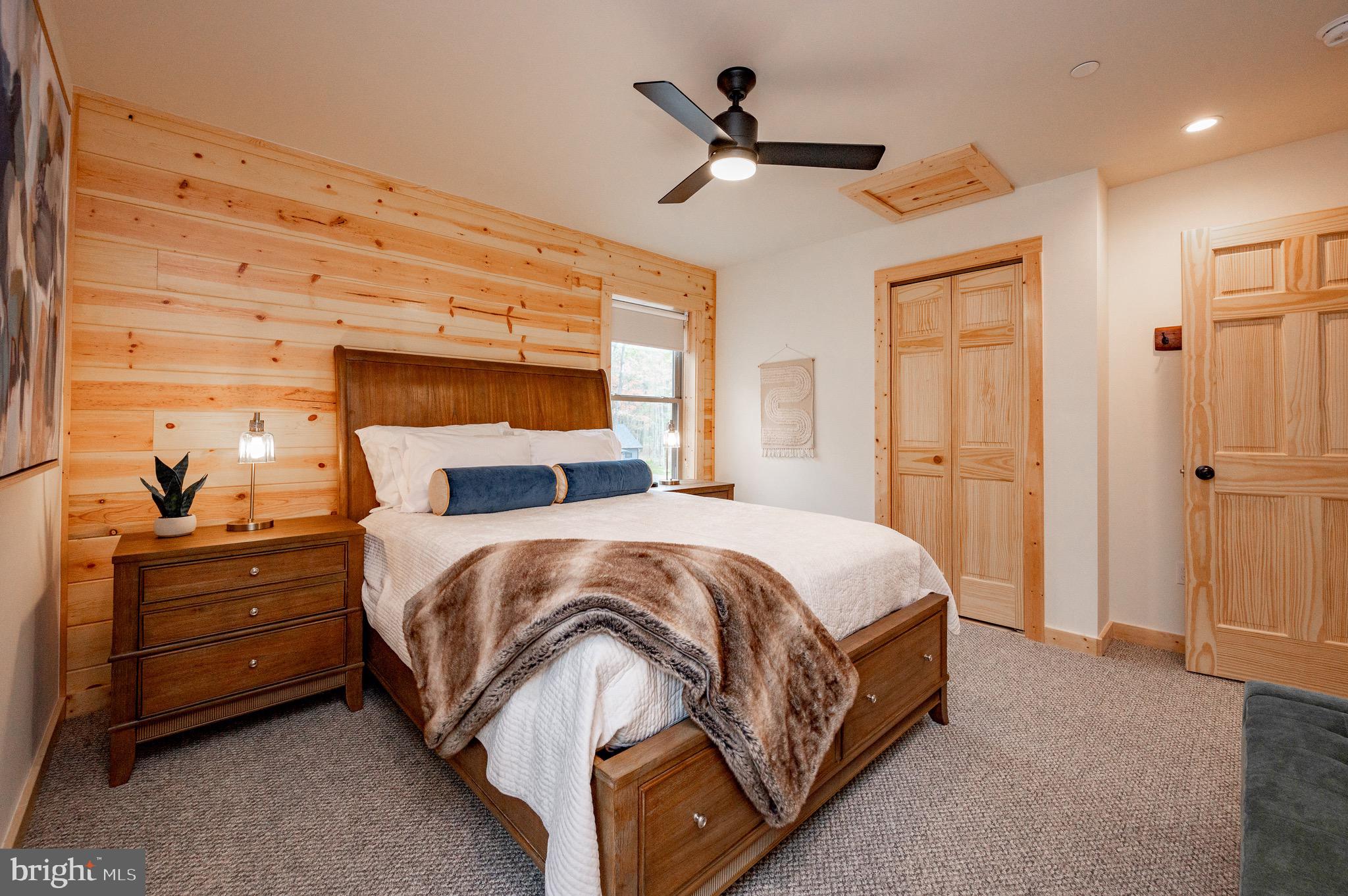 36 Irwin Way Oakland, MD 21550 - Photo 43 of 64 a bedroom with a bed a window and closet