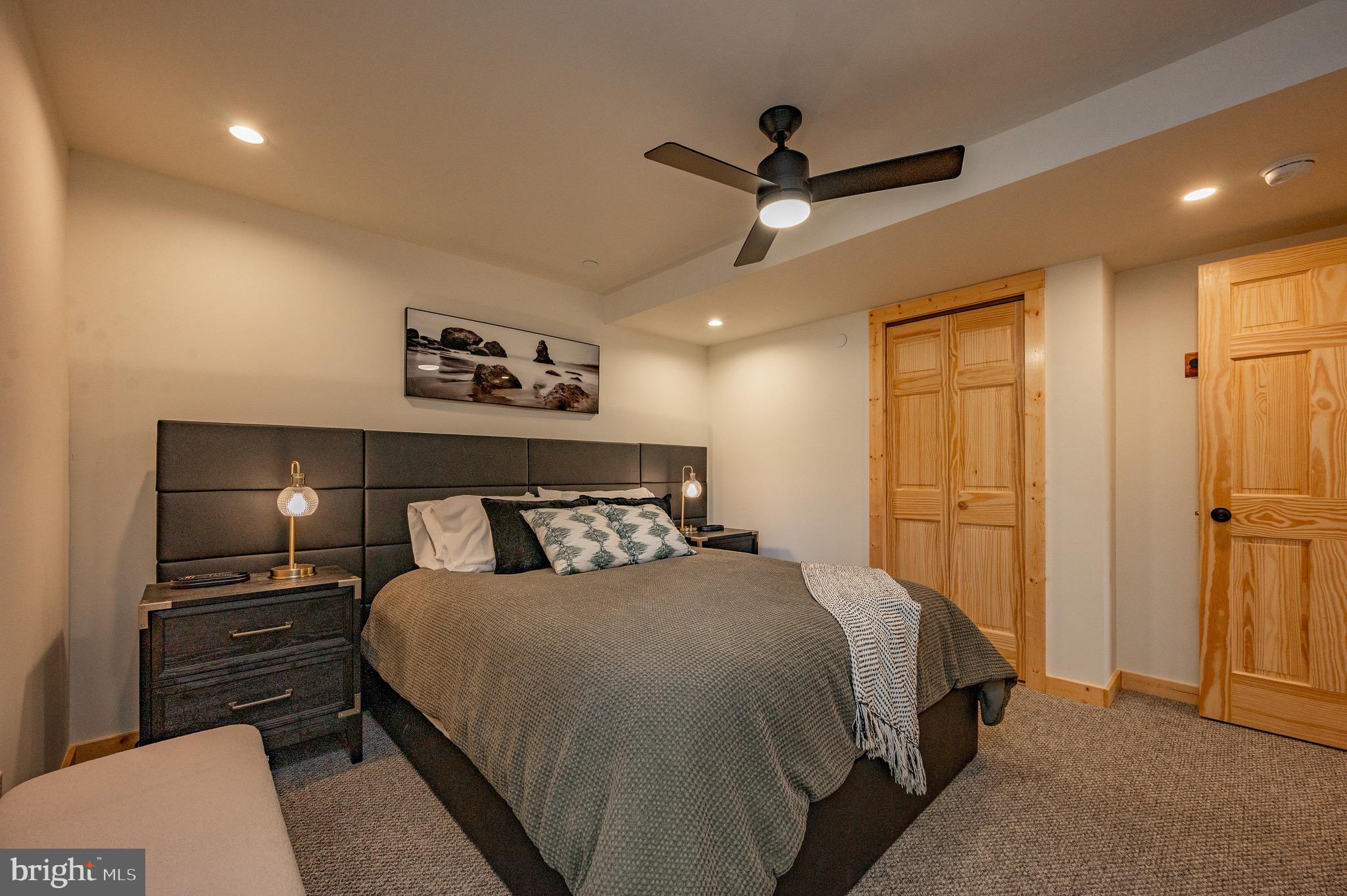 36 Irwin Way Oakland, MD 21550 - Photo 57 of 64 a bed room with a bed and a ceiling fan