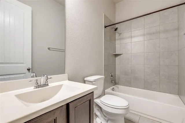 a bathroom with a sink a toilet and a bathtub