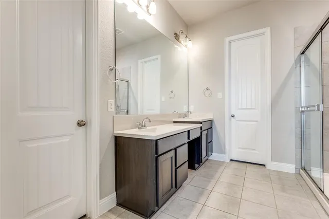 a view of a bathroom with a sink and mirror