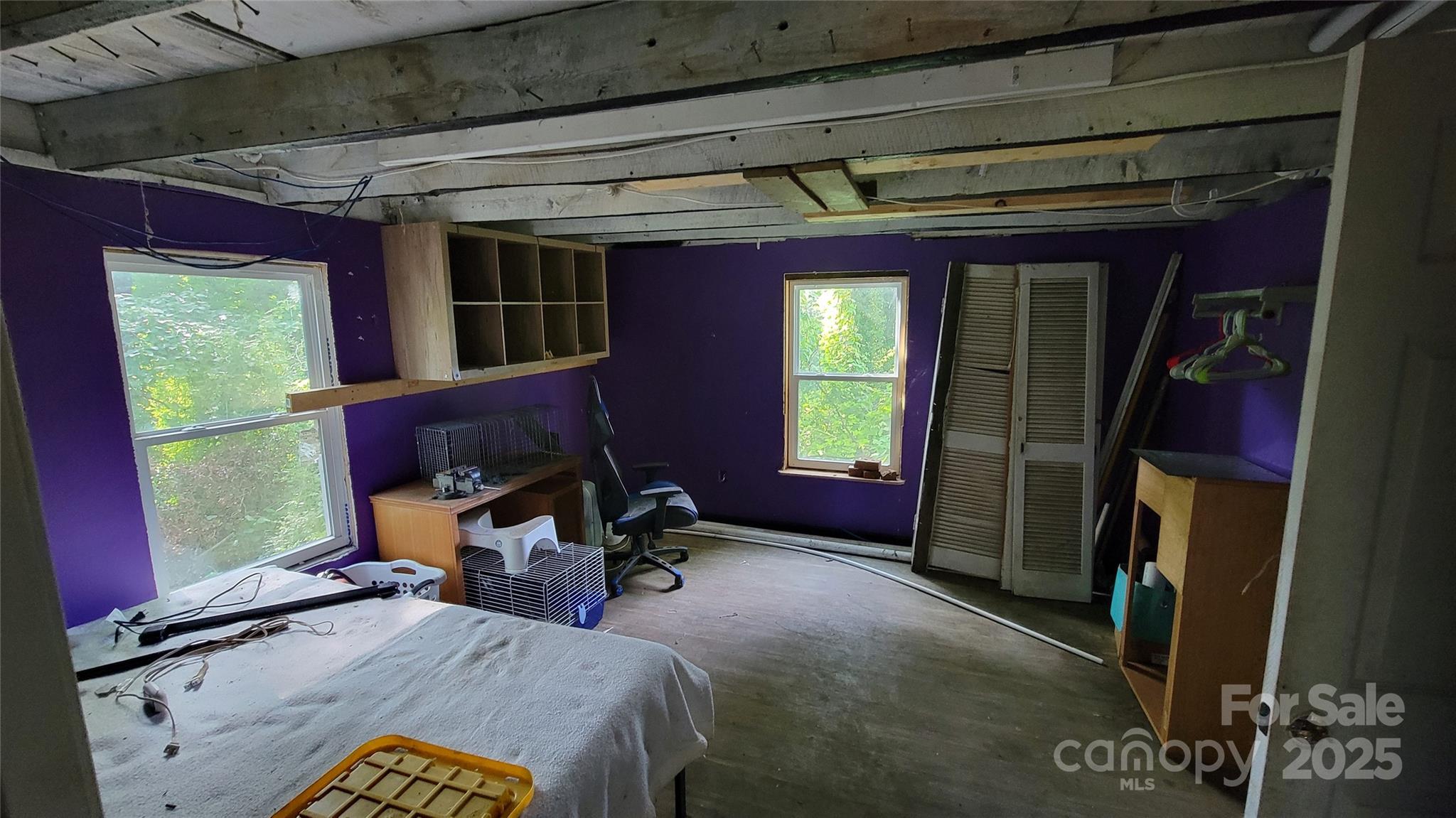 160 Cleveland Road Tryon, NC 28782 - Photo 11 of 42 a bed room with a bed and a window