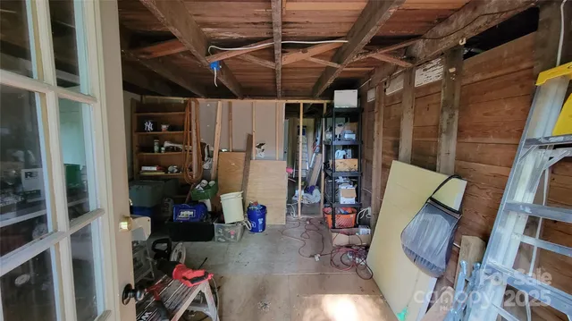 a shelf with water heater and wooden shelves